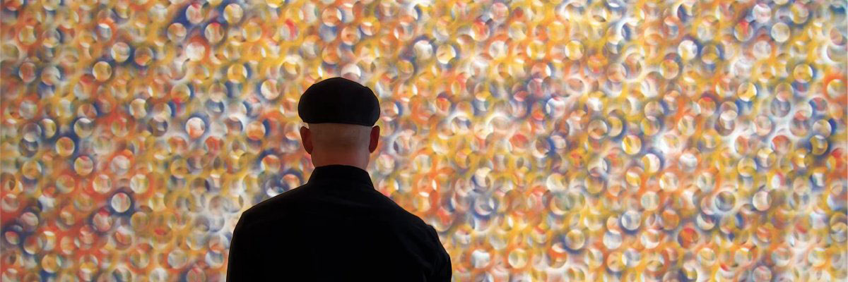Stephen Giannetti standing before his painting Summertime Supreme in his Davis, California studio